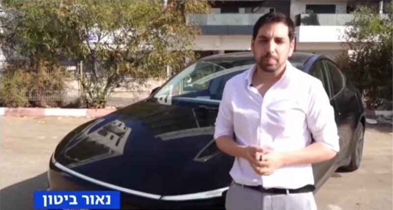 נאור ביטון והטסלה שלו. צילום מסך מתוך ערוץ 13
